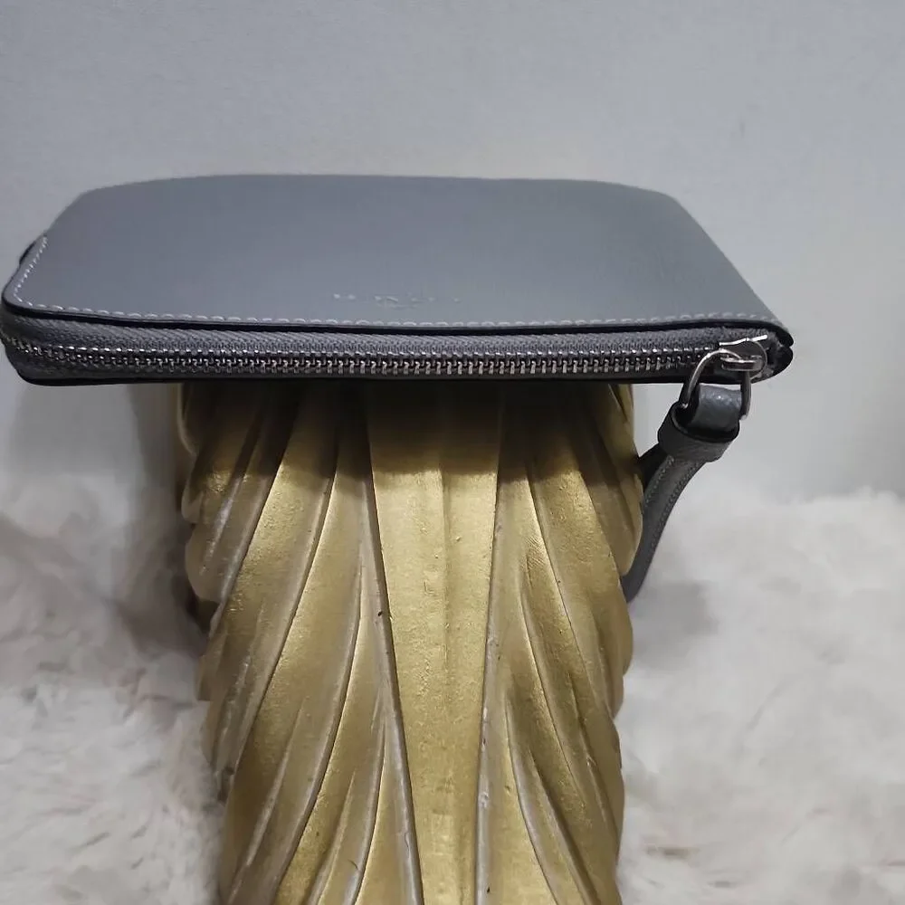 Coach Corner Zip Wristlet in a grey crossgrain leather.